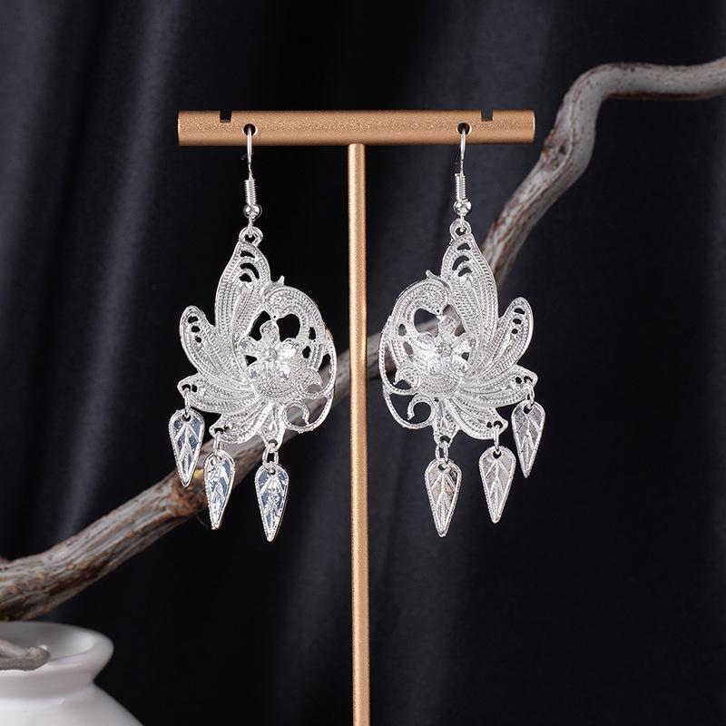 Bohemian Ethnic Miao Silver Tassel Earrings with Butterfly, Peacock, and Flower Design for Women – Long Dangle Jewelry for Travel Photos.