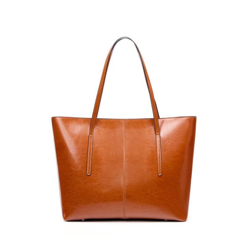 Large capacity leather tote bag, new versatile portable underarm bag, women's bag, niche shoulder bag.