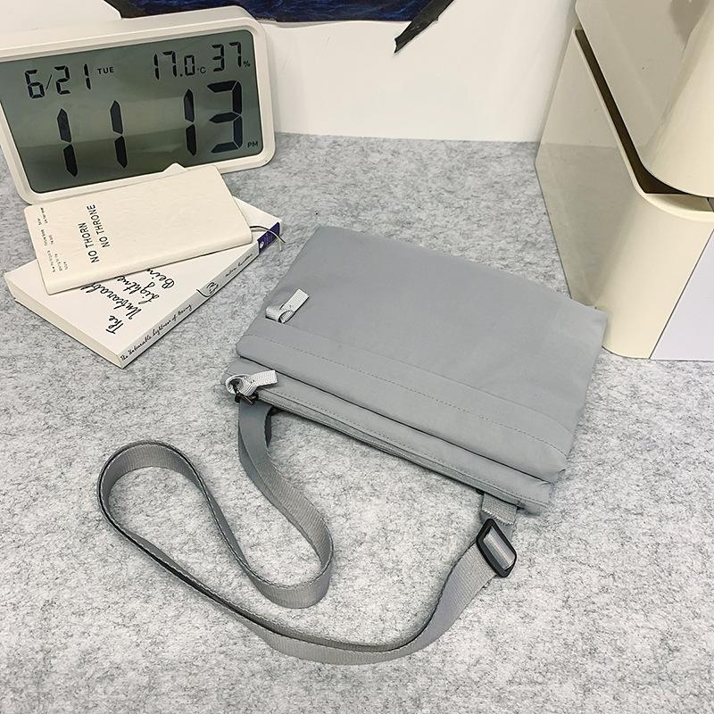

Lightweight casual messenger bag Personalized sports mobile phone bag Women s versatile small square bag Simple shoulder bag Breast bag Men s серый
