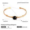 Elegante bracciale rigido aperto in acciaio al titanio e pietra naturale per donna