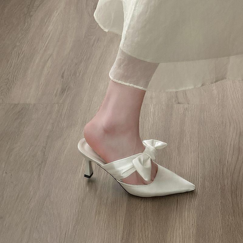 Height-increasing stiletto 2025 summer new bow pointed head bag head cool slippers women's niche going out high-value slippers