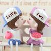 "Kissing Couple Resin Figurines: Cute Hanging Feet Decorative Ornaments for Living Room or Bedroom"