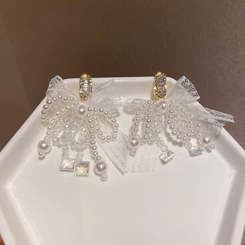 Silver needle pearl artificial crystal zircon bow stud earrings Korean super fairy fringed earrings fashion light luxury earrings