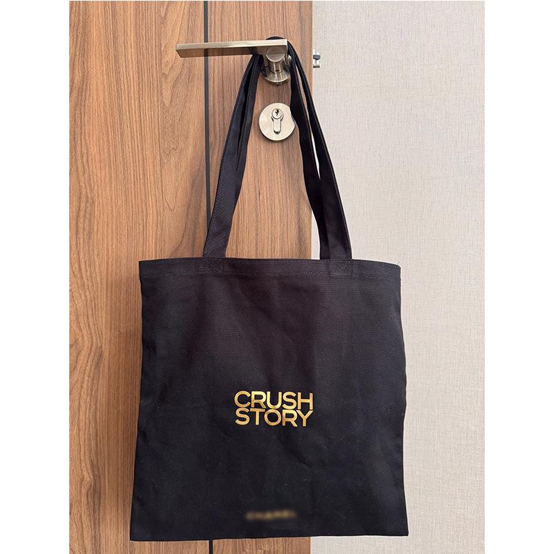 X Family Jewelry Series Black Canvas Tote Bag with Large Capacity and Hot Stamped Lettering