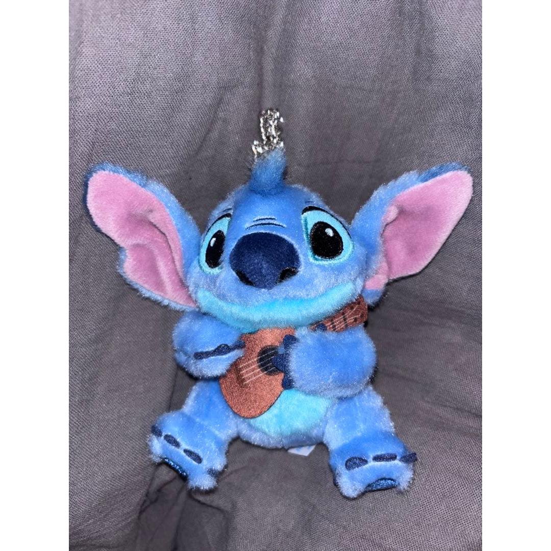 Stitch stuffed toy with guitar