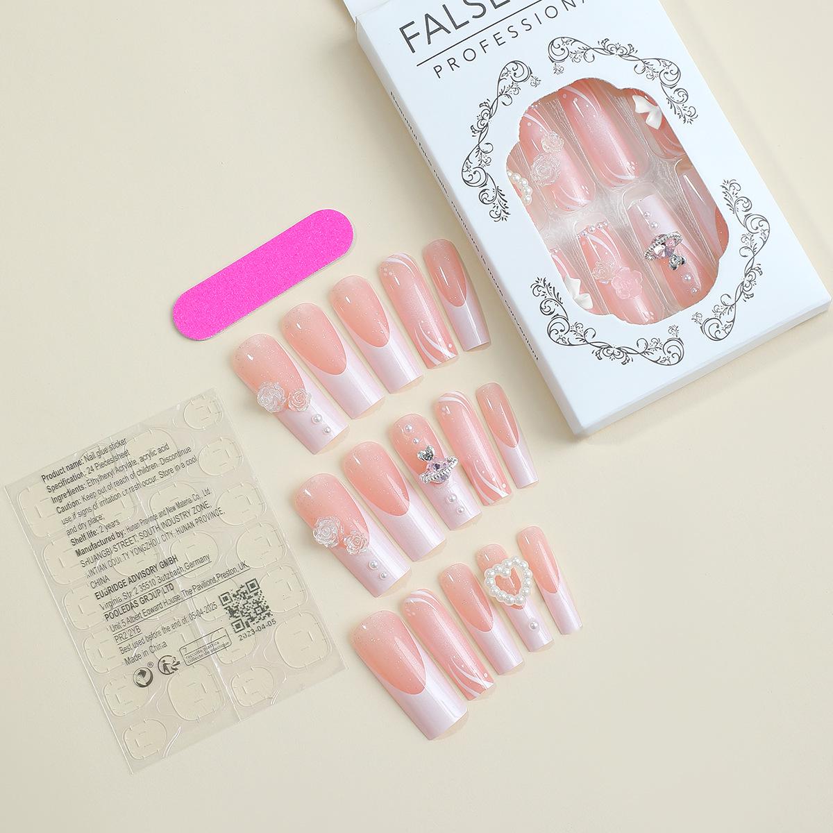 

Handmade Wearable Nails with French Edge, Pearl Rhinestones, and Bow