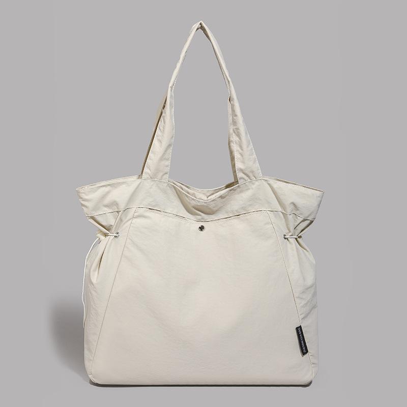 Simple and fashionable 2025 summer new fashion shoulder bag women's casual solid color large-capacity tote commuter bag