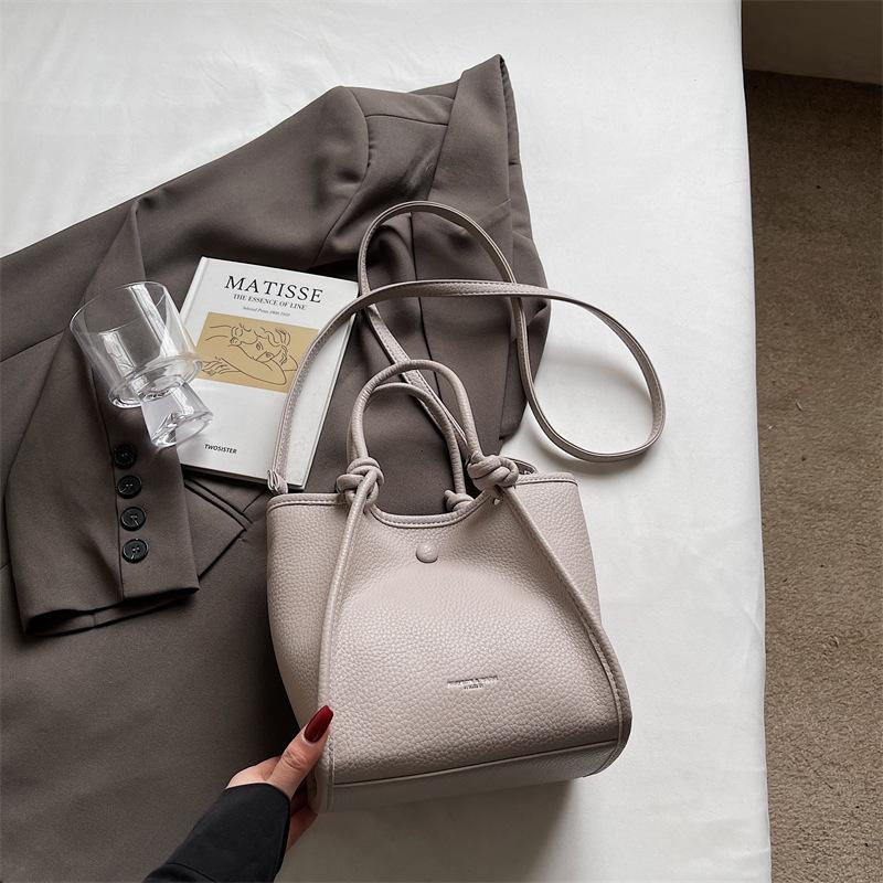 Korean Version of Niche Portable Commuter Bag Women's 2025 New Simple Bucket Bag Versatile Shoulder Cross Wing Bag