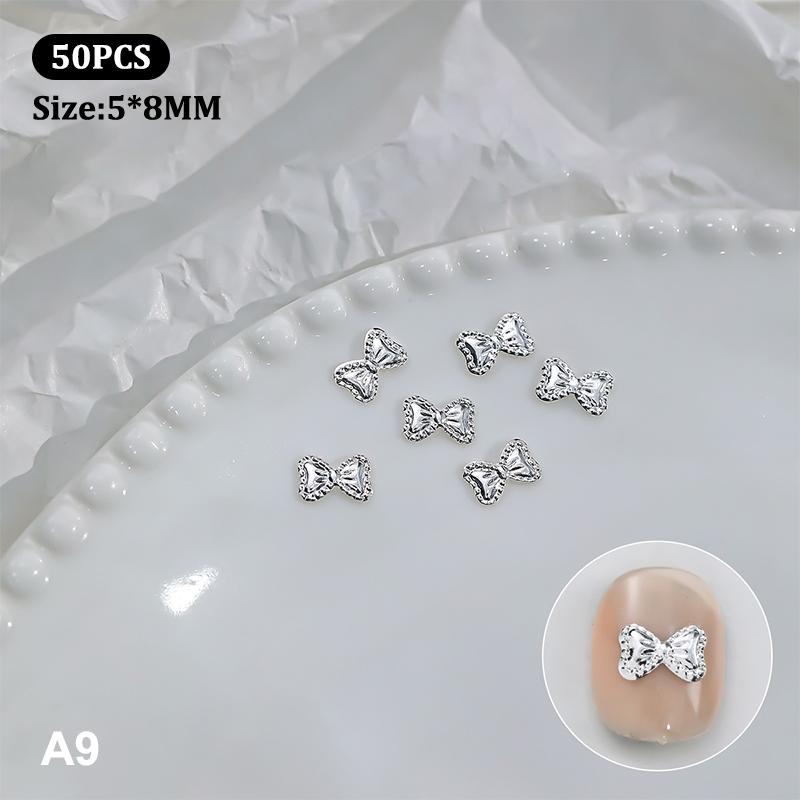 50 st Metalllegering Rosett Naglar Konst Dekoration Silver Guld Nagelberlocker DIY Manikyr Design Smyckestillbehör Verktyg