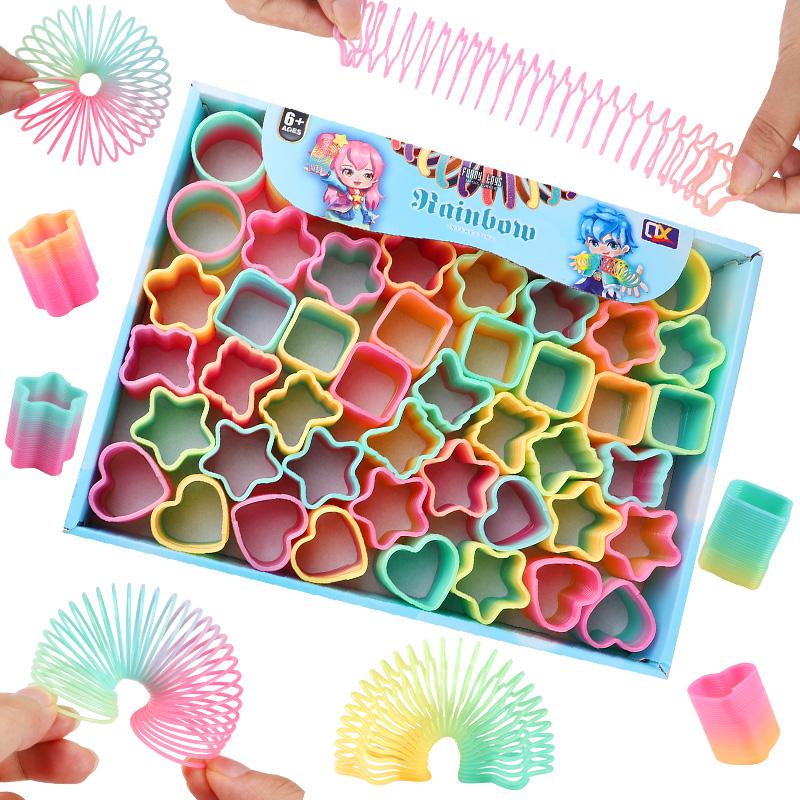 12/24 Stück Regenbogen Magische Feder Hüpfspielzeug Kindergeburtstag Mitgebsel Goodie Piñata Füller Fidget Spielzeug Kreative Weihnachtsgeschenke