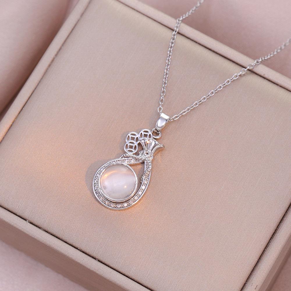 Women's Influencer Necklace: Cat's Eye Stone Rotating Pendant with Clavicle Chain Design