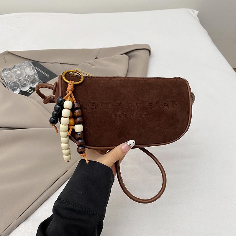 

Korean version of fashionable simple women s bag 2025 autumn new solid color small square bag niche casual commuter shoulder messenger bag