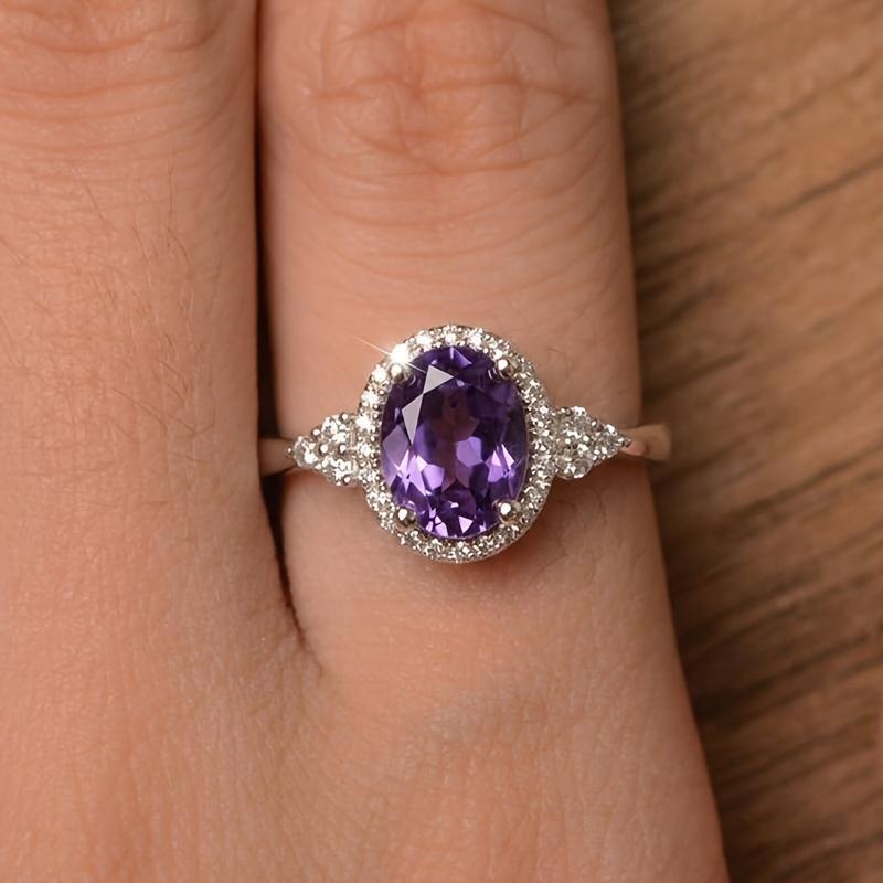 Elegant Oval-shaped Women's Engagement Ring, Elegantly Inlaid with Sparkling and Charming Purple Synthetic Zirconia, Designed As a Luxurious and