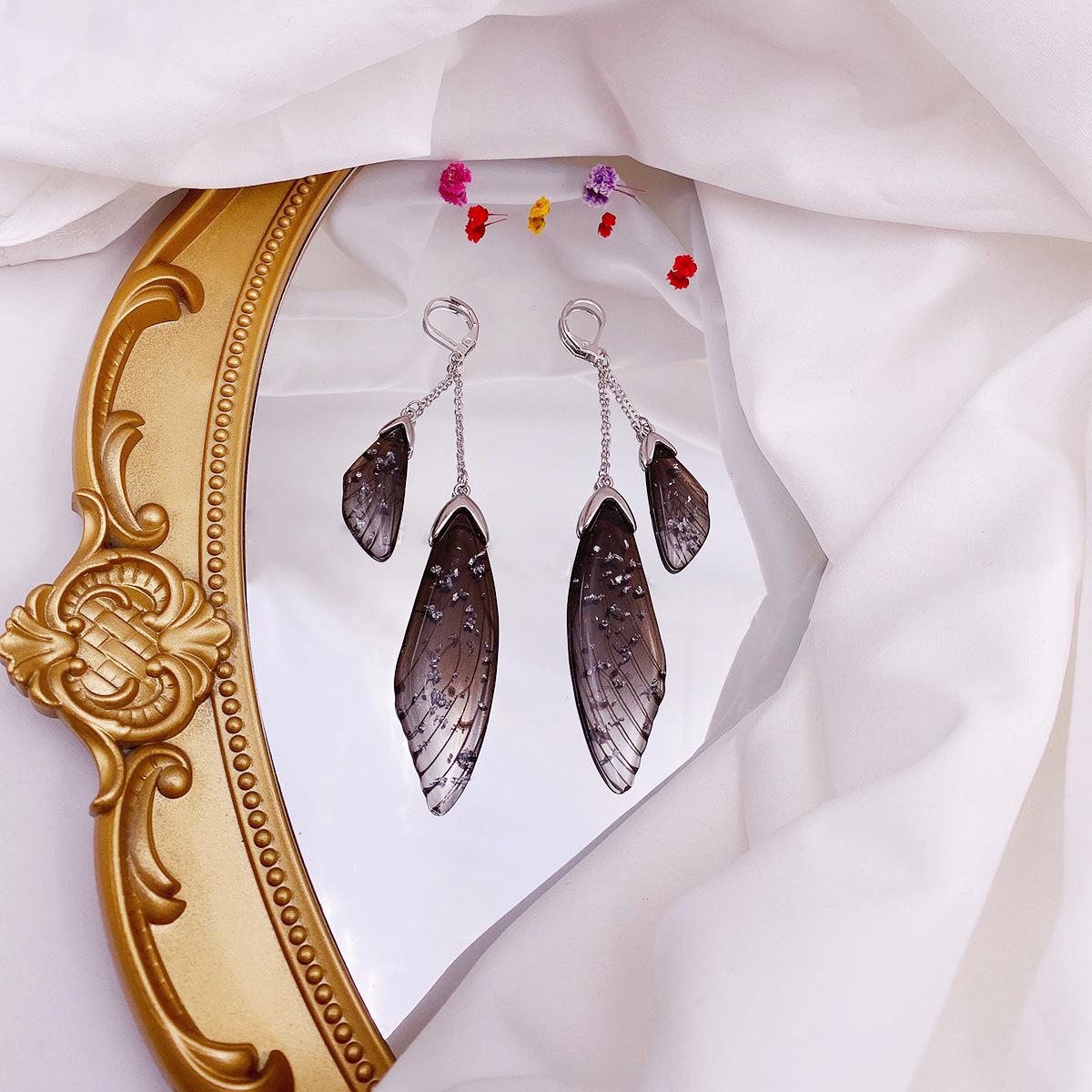 

Butterfly black wings earrings cicada wings wings gradual change color stud earrings temperament super fairy long earrings
