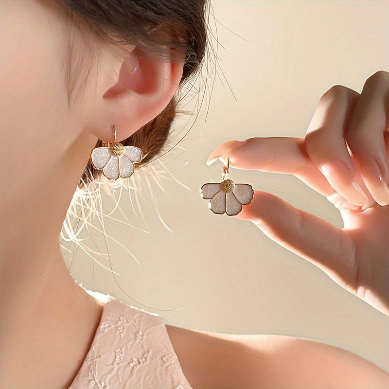 A pair of elegant French-style floral drop earrings, featuring a delicate four-petal flower design, perfect for everyday wear, parties, and vacations.