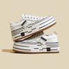 Thick-soled heightening canvas shoes women's 2025 spring new design sense niche pink beggar shoes sports and leisure board shoes