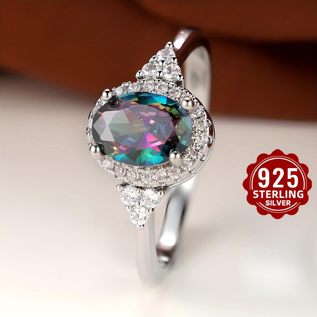 This elegant oval diamond ring is made of 925 sterling silver with a circular design