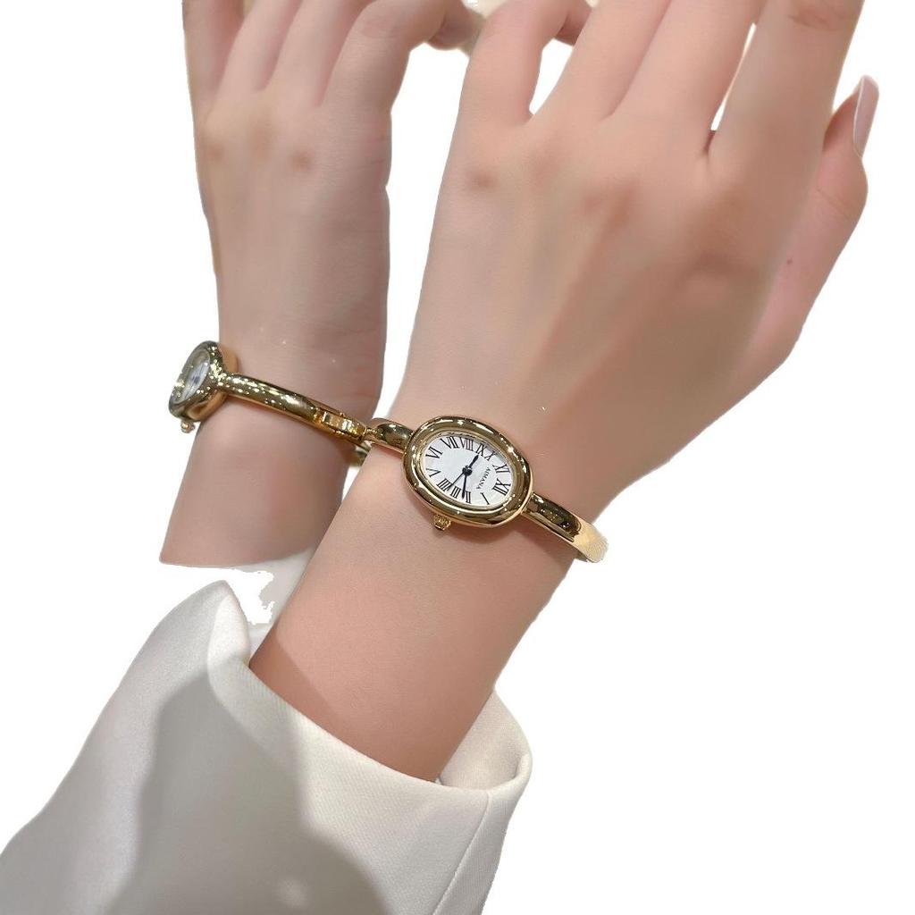 AIMANA Women's Oval Quartz Bracelet Watch: Small Dial, Roman Numerals, Light Luxury Style.