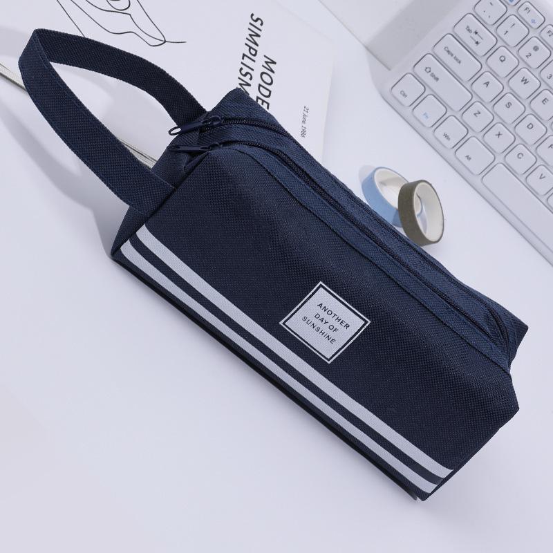 

Creative large-capacity pencil case, simple Oxford cloth double zipper pencil case, male and female students portable stationery bag темно-синий