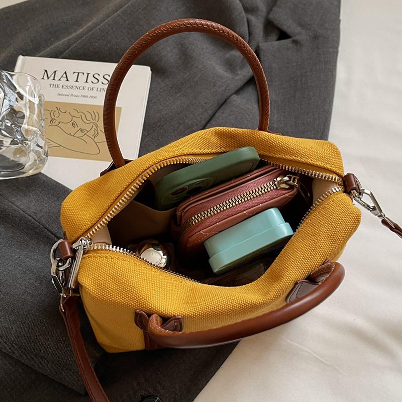 Classic Canvas Duffel Bag with Leather Trim and Adjustable Strap Perfect for Travel and Everyday Use