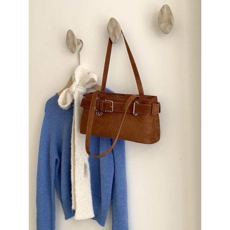 

Autumn and winter new armpit bag niche design belt decoration shoulder bag women s high-end sense retro suede bag коричневый