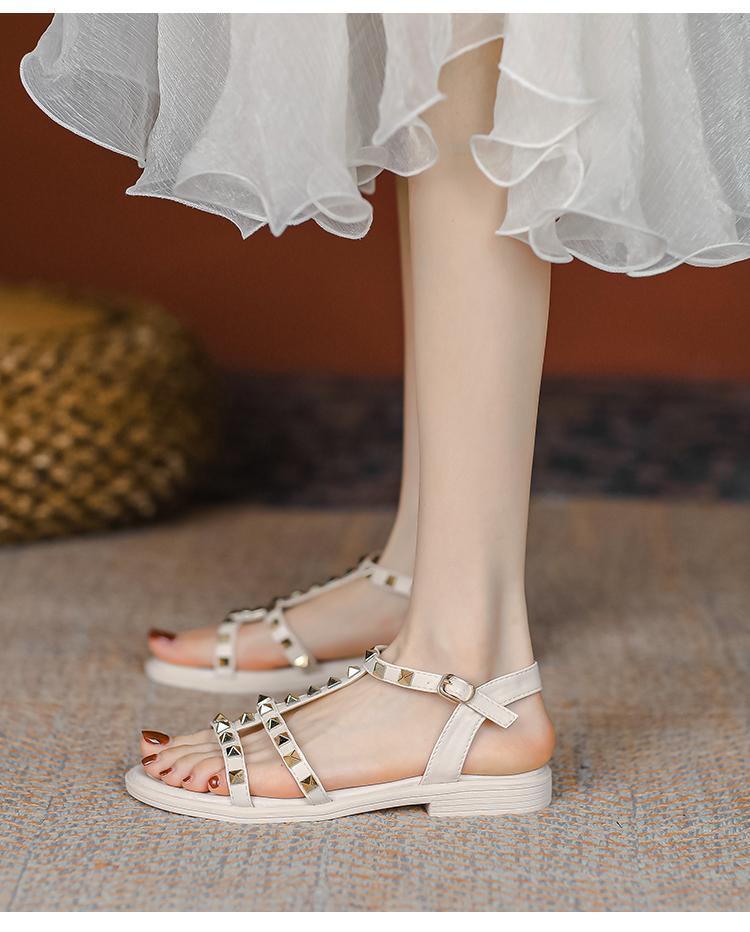 2025 summer new versatile flat-bottomed fairy style with skirt rivets Roman fashion Internet celebrity sandals women