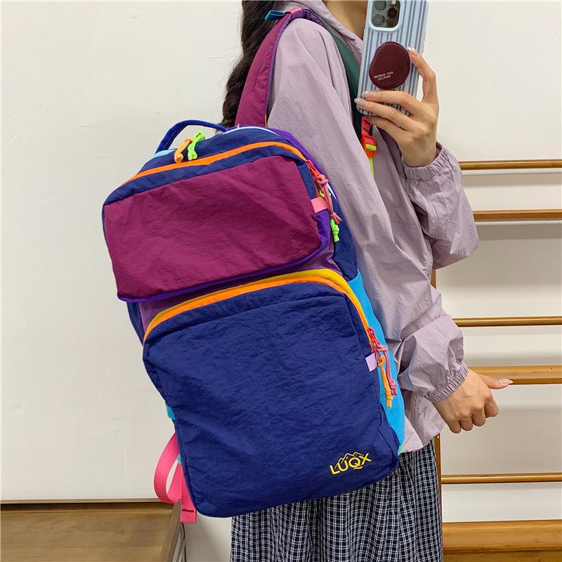 Cartable à dos de grande valeur pour femmes 1011 nouvelle version coréenne grande capacité léger sac d'école étudiant sac à dos décontracté tendance