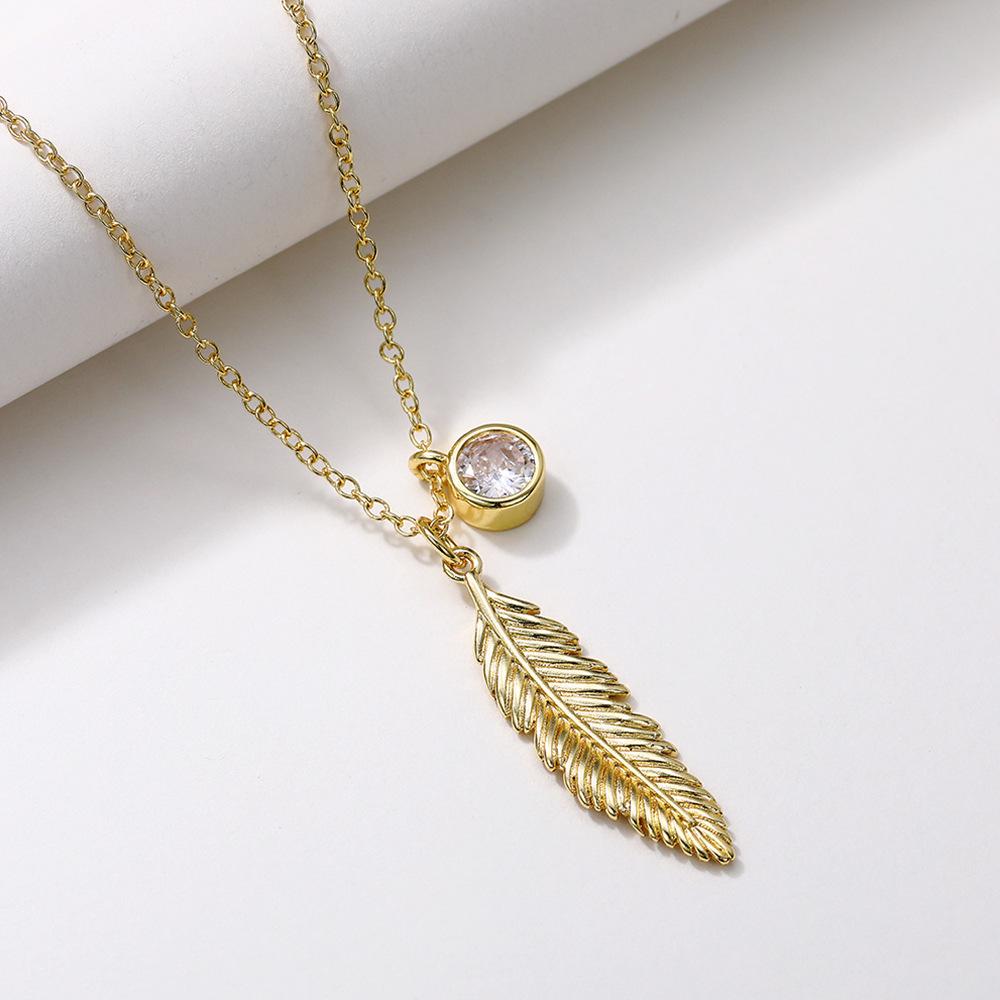 Vintage Feather Pendant Necklace with Sparkling Round Stone Accent Elegant Nature Inspired Jewelry for Women