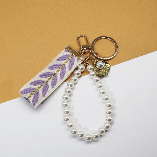 Trending 2025 Keychain Set Fashion Minimalist Pearl Car Keychain Woven Stripe Bag Charm Elegant Women Keychain Organizer Gift