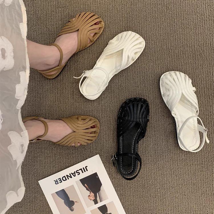 Mori baotou sandals female 2025 summer new fairy wind woven Roman shoes hollow flat bottom pig cage beach shoes