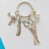 Stylist Keychain: Scissors, Comb, Clippers & Dryer