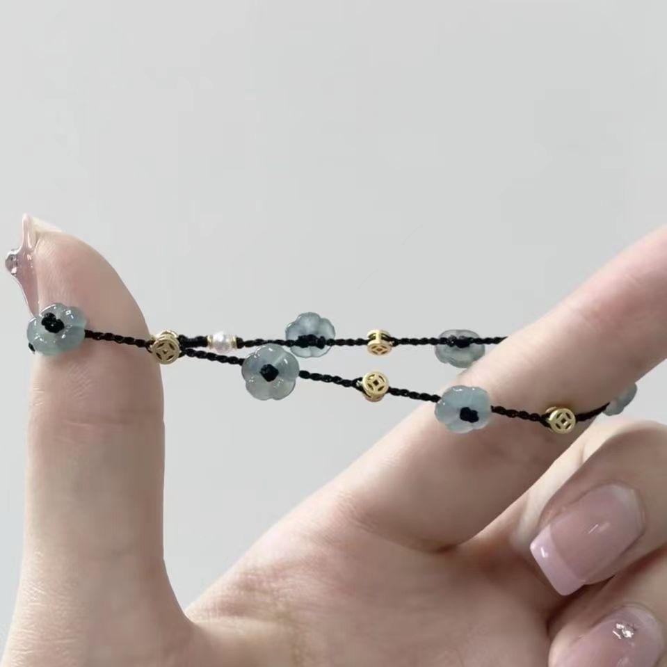 Black Woven Rope Bracelet with Pearl-Embellished Flower Design