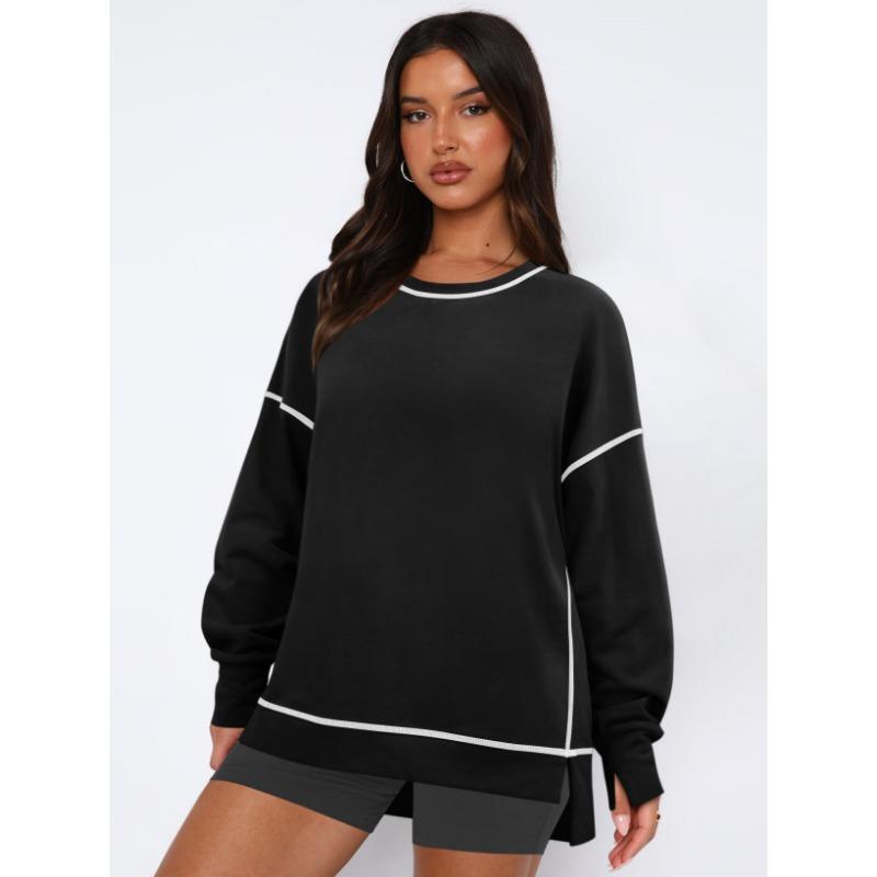 Женский контрастный пуловер свободного кроя с длинными рукавами с разрезами — фото 4