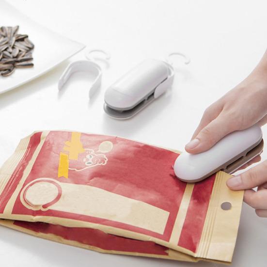 Tragbare Mini-Aufbewahrungs-Kunststoff-Versiegelungsmaschine für Lebensmittel-Wärmebeutel, Handversiegelung