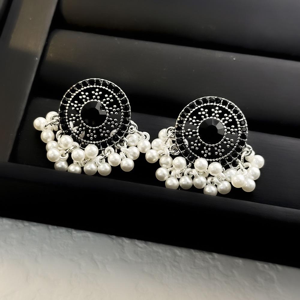 Elegant Gold-Plated Black Zircon Stud Earrings - Niche Design for a Luxurious Fashion Statement
