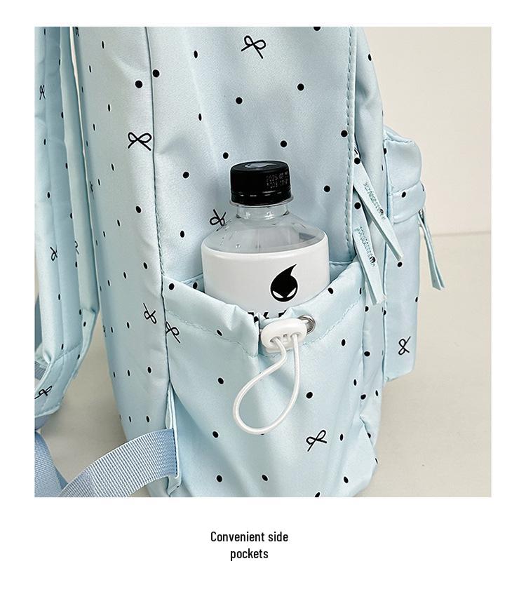 Polka Dot Bow Backpack for Teen Girls: Stylish and Versatile Schoolbag for Middle and High School Students.