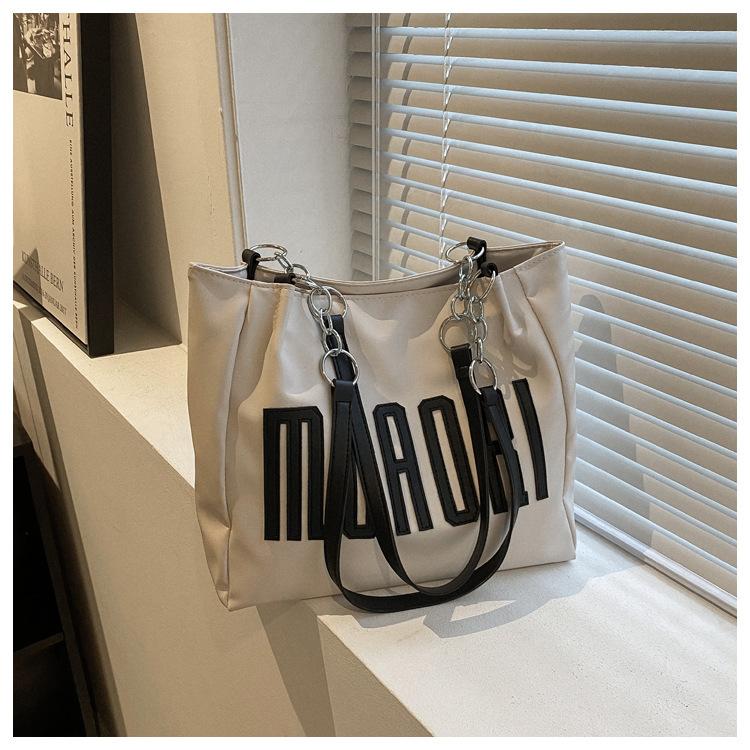 

Large capacity tote bag PU soft surface tide letter single shoulder hand carry women s bag handbag bag темно-коричневого кольору