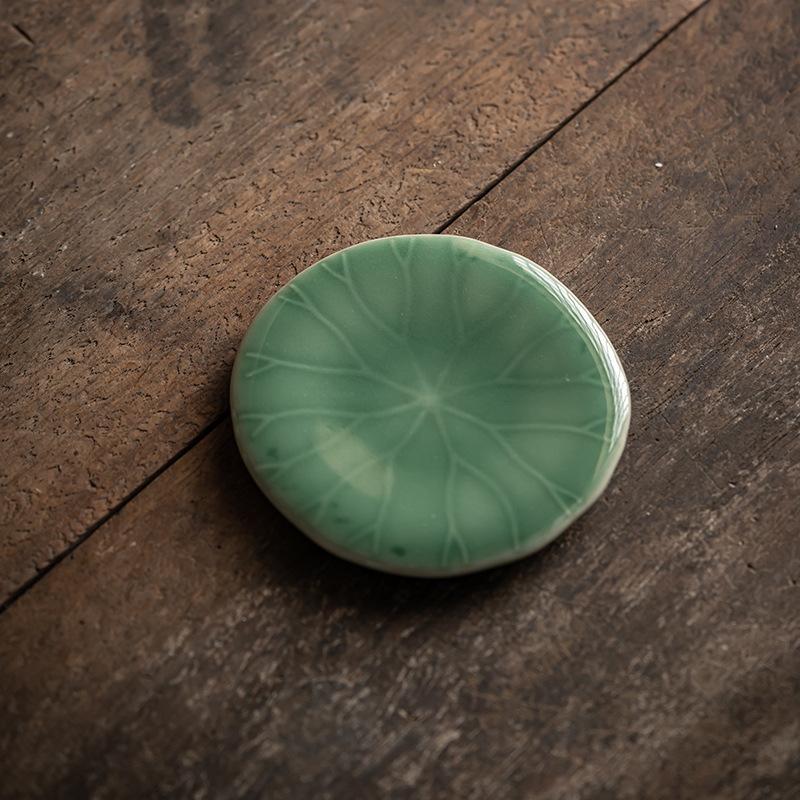 

Celadon shadow carving coaster, Chinese antique kung fu tea set, handmade tea holder, ceramic lotus leaf coaster