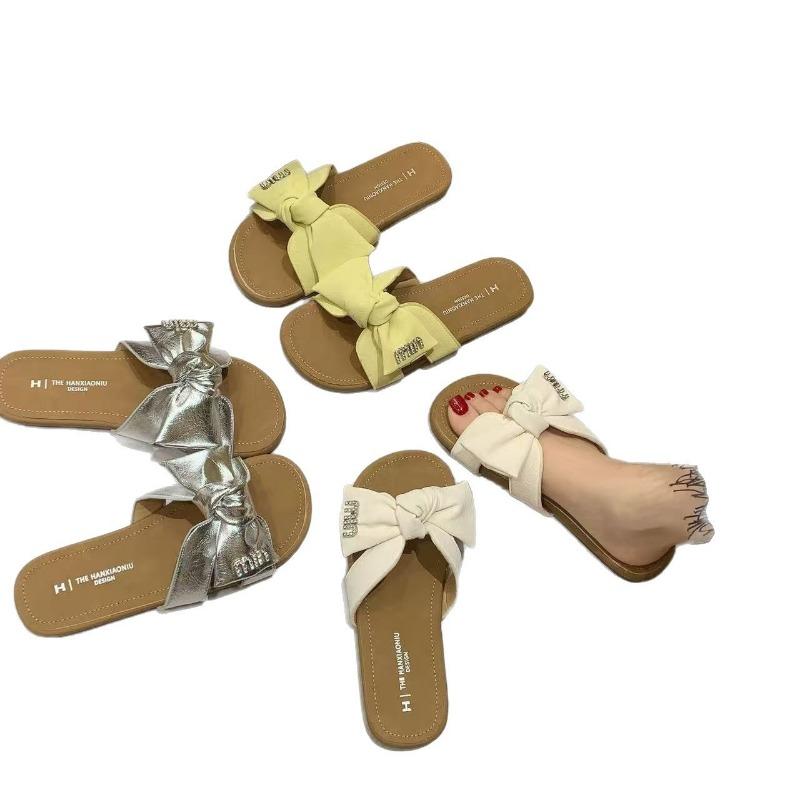 Summer new women's shoes flat-soled wear cool slippers bow fashion one-word drag soft-soled beach shoes