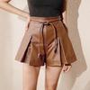 European and American Fashion Caramel Color Warm Brown Leather Texture PU Leather Skirt, High Waist Strap Waist Pleated Shorts Skirt