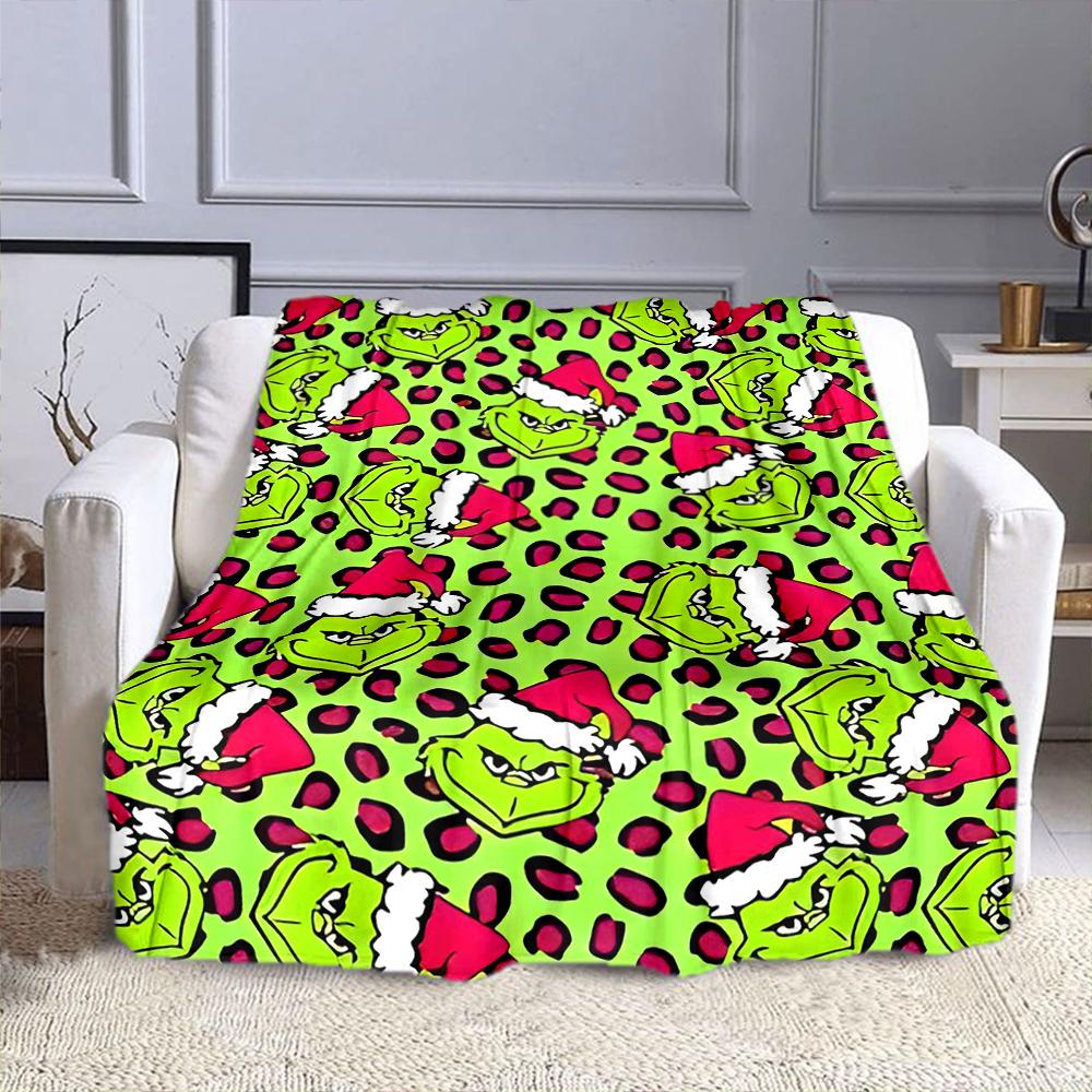 "Grinch Faces with Santa Hats Pattern" Patterned flannel blanket perfect for the bedroom living room, sofa, or a little nap