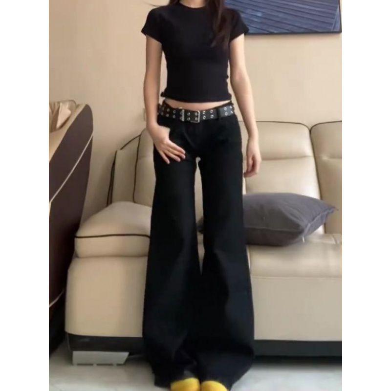 Női, alacsony derekú fekete, széles szárú, kiszélesedő farmernadrág – nagy, laza szabású tavaszra és őszre