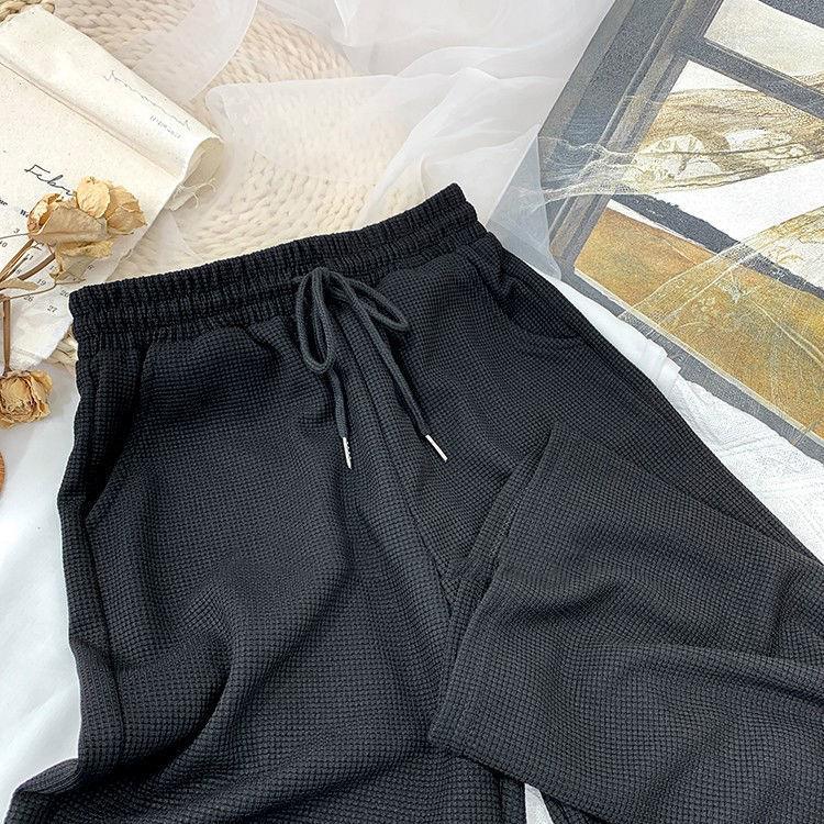 Waflowe elastyczne spodnie z wysokim stanem na co dzień jesienne i zimowe damskie koreański styl luźne drapowane spodnie szerokie nogawki pokaż długość nóg sportowe spodnie do biegania
