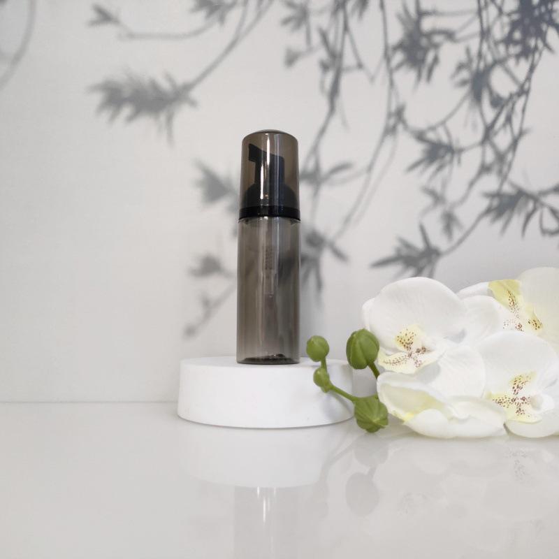 Available 60ml Transparent Black Foam Mousse Bottle for Face Wash and Travel-friendly Cosmetic Packaging.