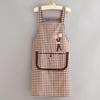 Black And White Checkered Apron With Cute Flower Decorations And Large Pockets.