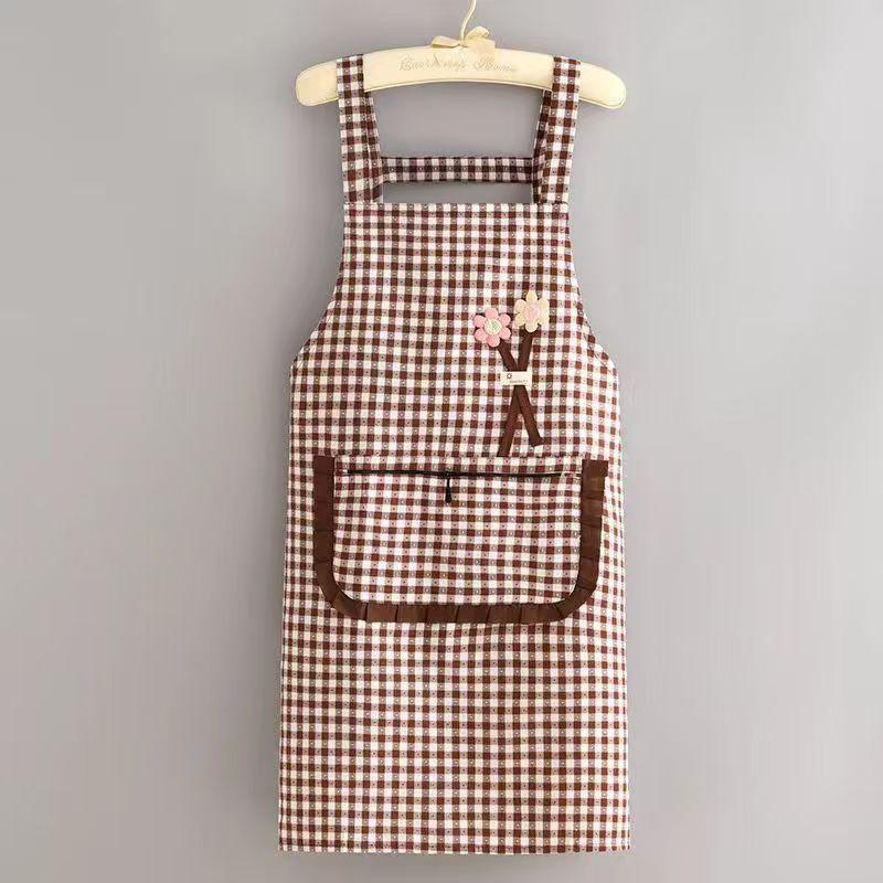Black And White Checkered Apron With Cute Flower Decorations And Large Pockets.