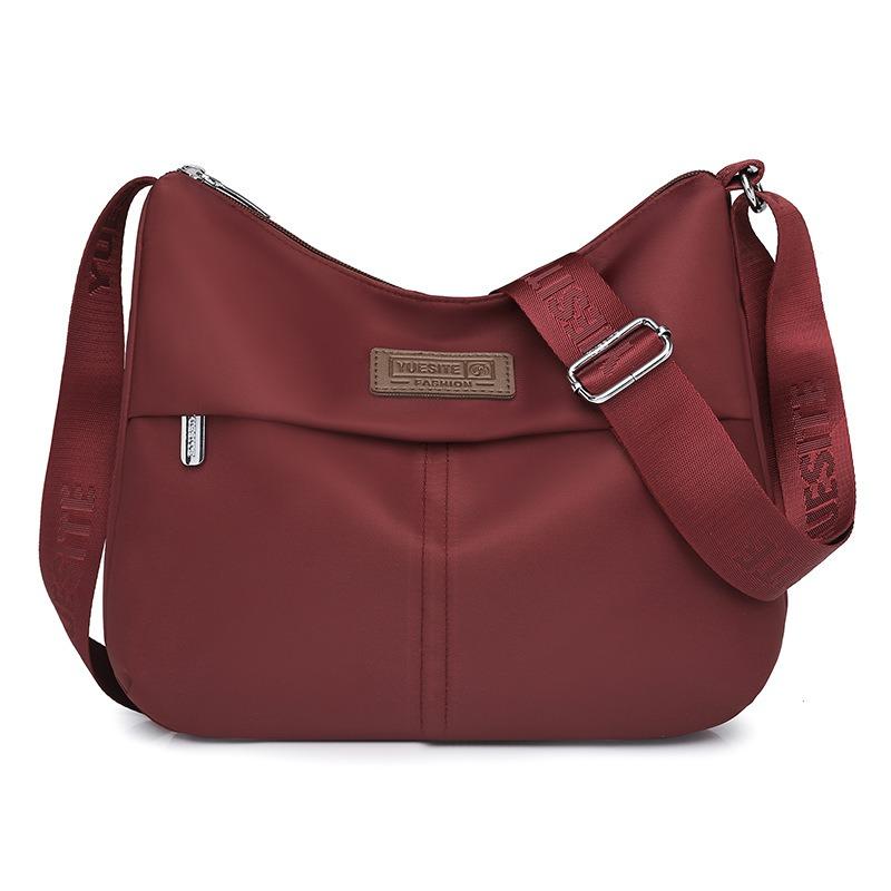 Einfacher und großzügiger Schulterrucksack Vielseitige, spritzwassergeschützte Nylontasche mit großem Fassungsvermögen Modetrend schräg getragener Damenrucksack