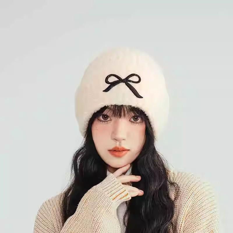 Hat women's autumn and winter wool hat new cute bow versatile cold hat ear protection warm knitted hat tide