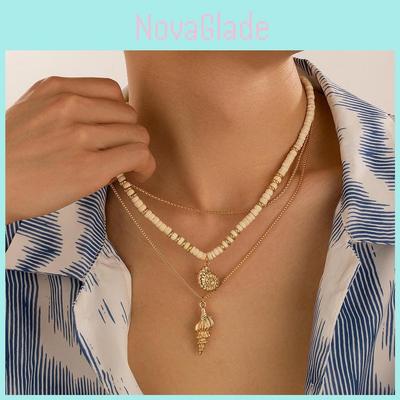 Stilvolles Sommer-Kokosnussschalen-Perlenhalskette mit Muscheln und Weichton-Anhänger-Designs