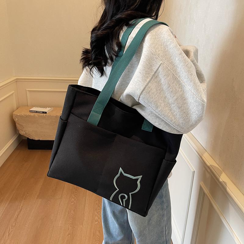 2025 new niche design women's bag on the street portable tote bag cute student messenger bag fashion shoulder bag women